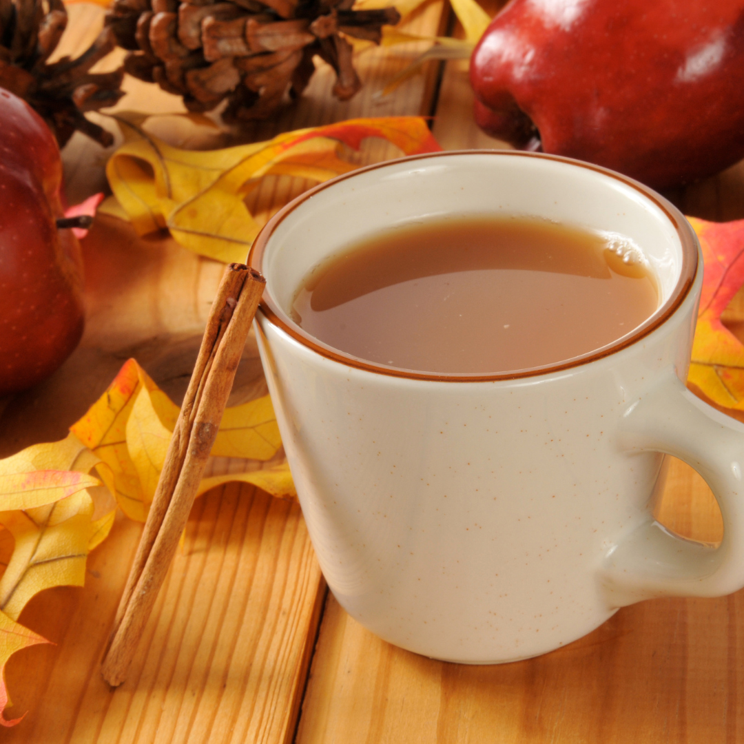 White mug full of homemade apple cider