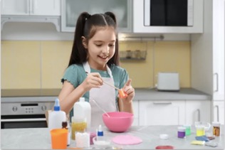 girl playing with arts and crafts