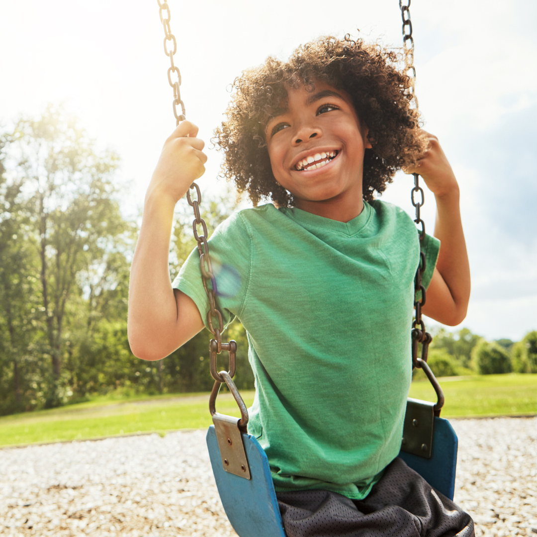 Kid swinging on a swing set