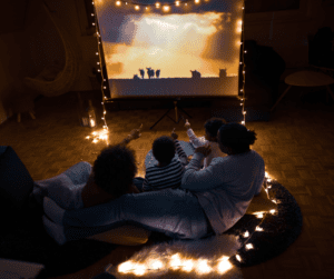  Family enjoying a movie night at home with a projector screen.