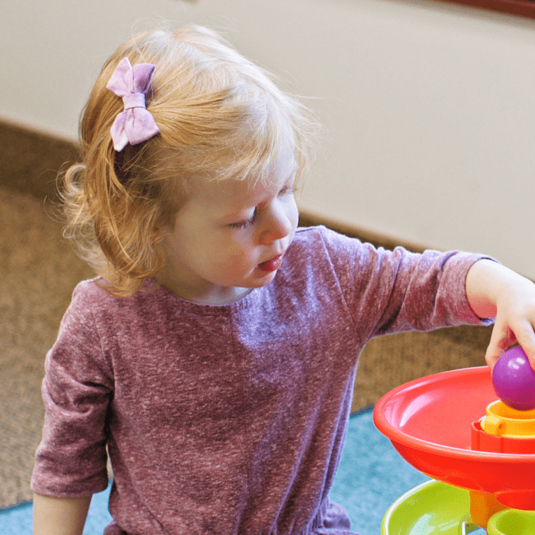 Toddler playing with toys