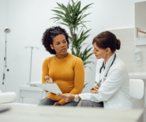 A woman talks to a doctor