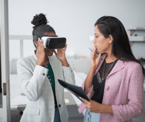 Doctor wears VR headset for ABA therapy and provider takes notes.