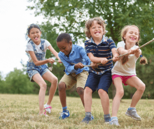 Four kids play tug of war.